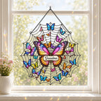 Personalized grandma butterfly and web holographic acrylic suncatcher in a sunlit window