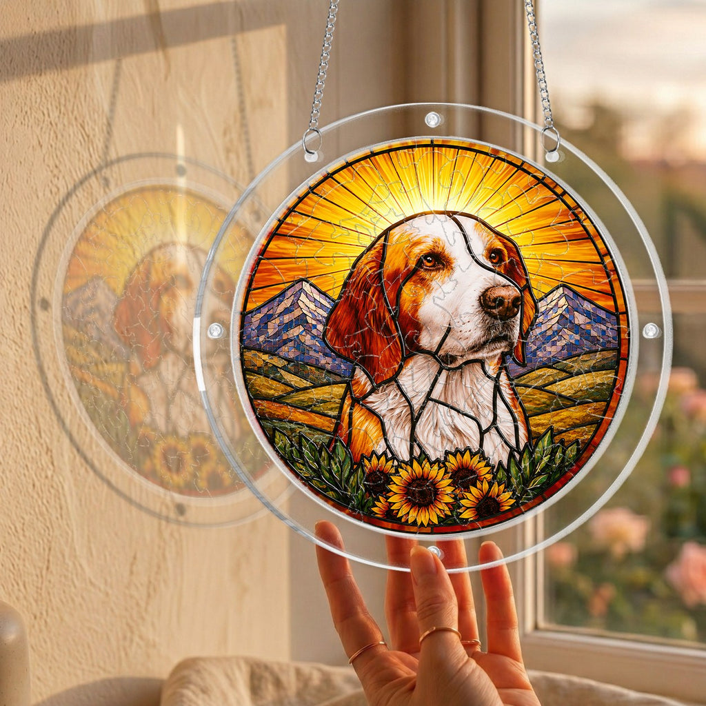 Dog memorial puzzle suncatcher held up to a sunlit window