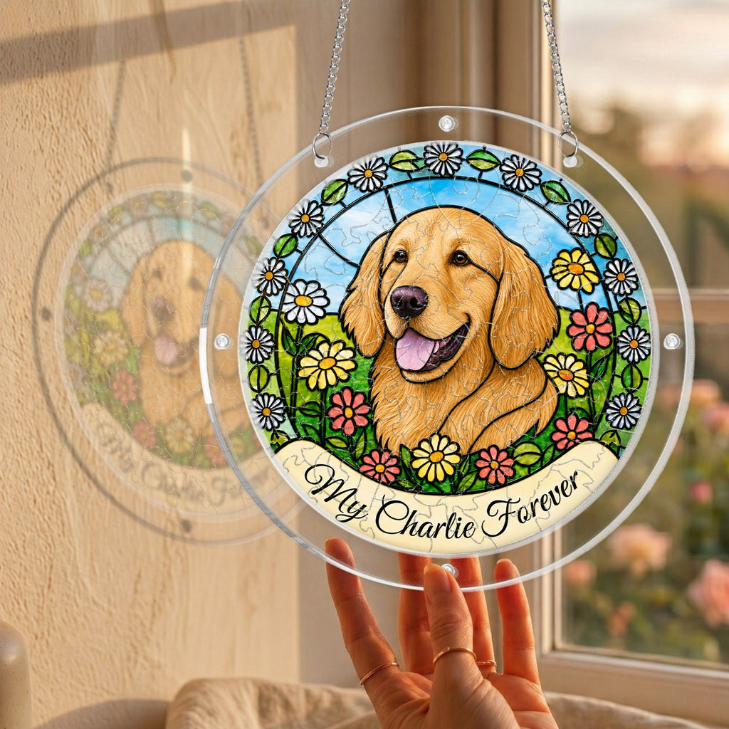Hand holding the daisy garden dog memorial puzzle suncatcher up to a sunlit window