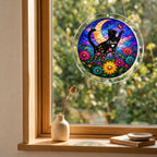 Cat memorial puzzle suncatcher hanging in a sunny window