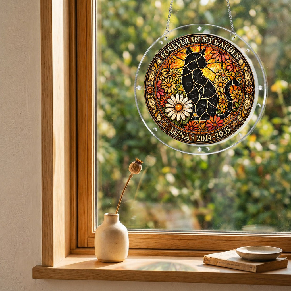 Cat memorial puzzle suncatcher hanging in a sunny window