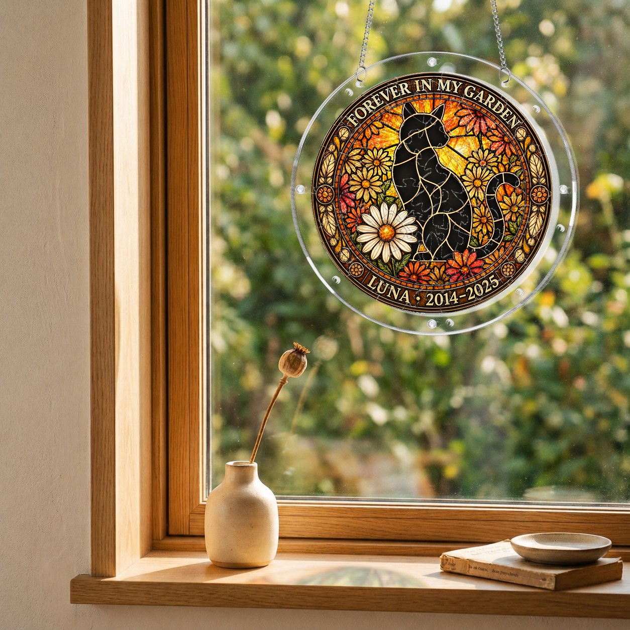 Cat memorial puzzle suncatcher hanging in a sunny window