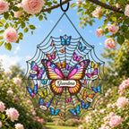 Butterfly web suncatcher hanging outdoors among roses