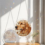 Dog memorial suncatcher hanging in a sunlit window with sheer curtains