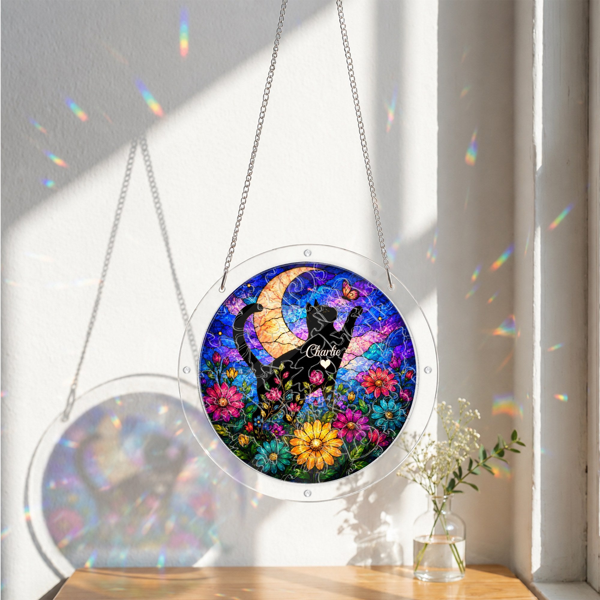 Cat memorial puzzle suncatcher catching colorful sunlight