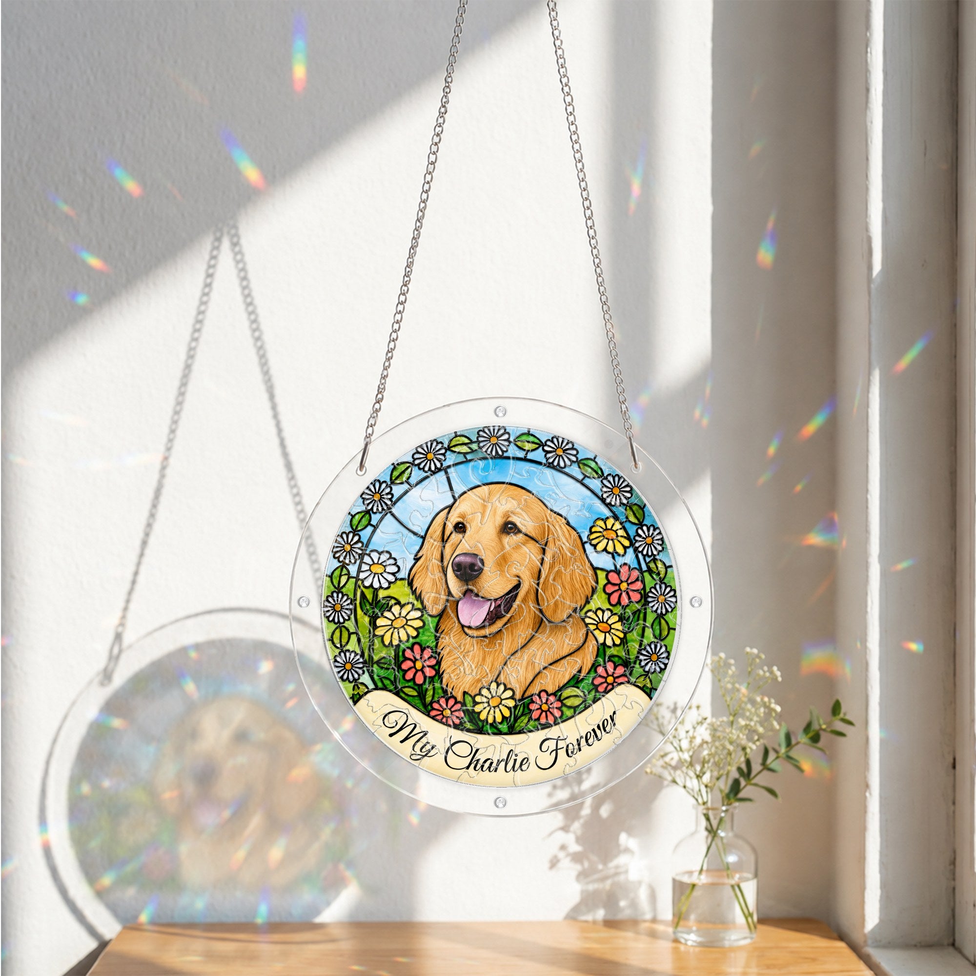 Daisy garden dog memorial suncatcher hanging in a sunlit window with sheer curtains
