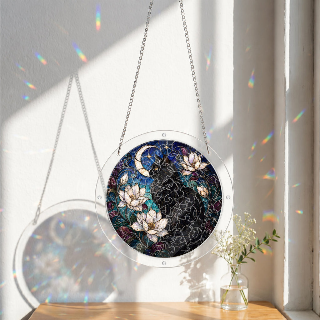 Black cat memorial puzzle suncatcher catching colorful sunlight
