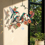 Decorative hologram arcylic suncatcher with colorful hummingbirds and flowers hanging on a window.