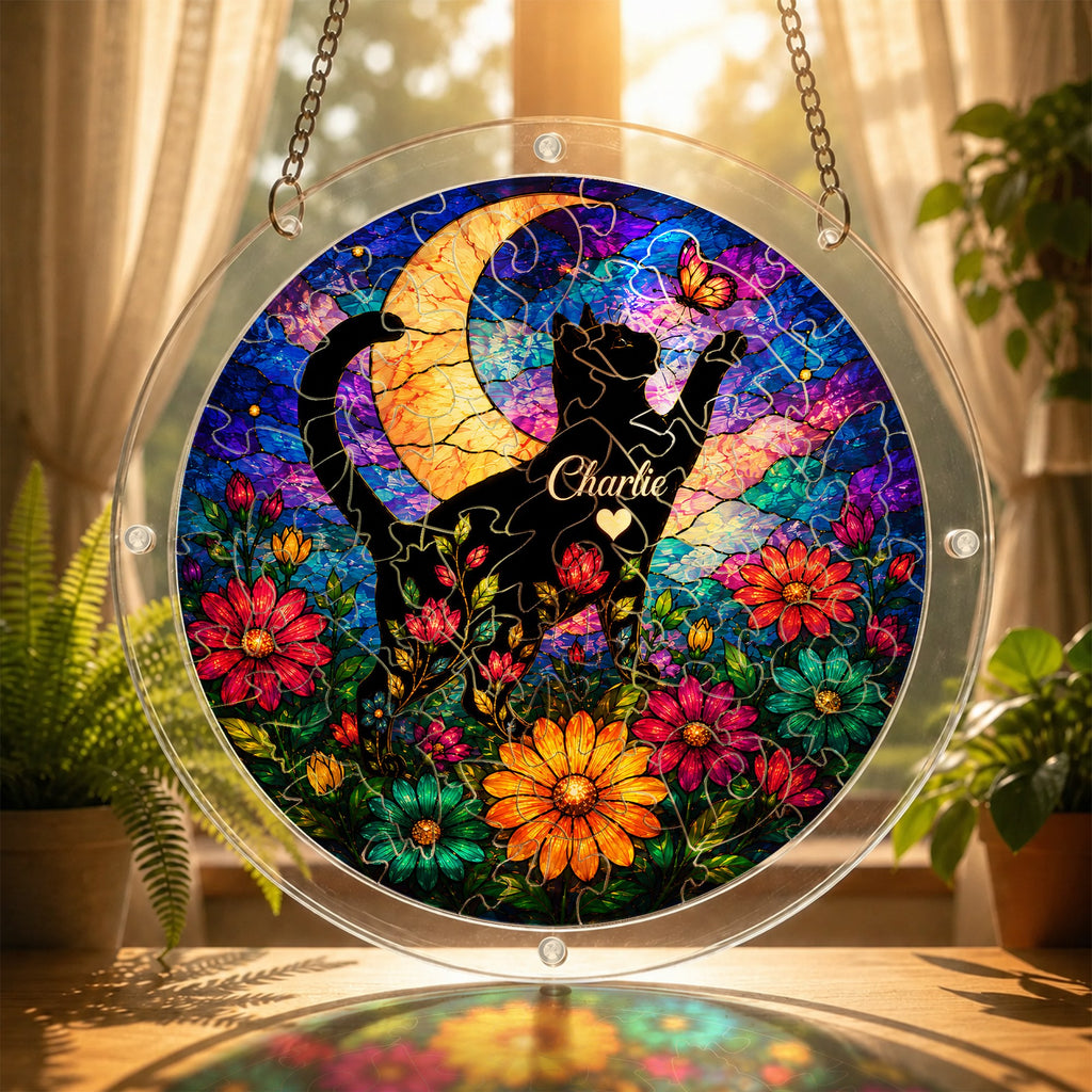 Cat memorial puzzle suncatcher glowing in a sunny window