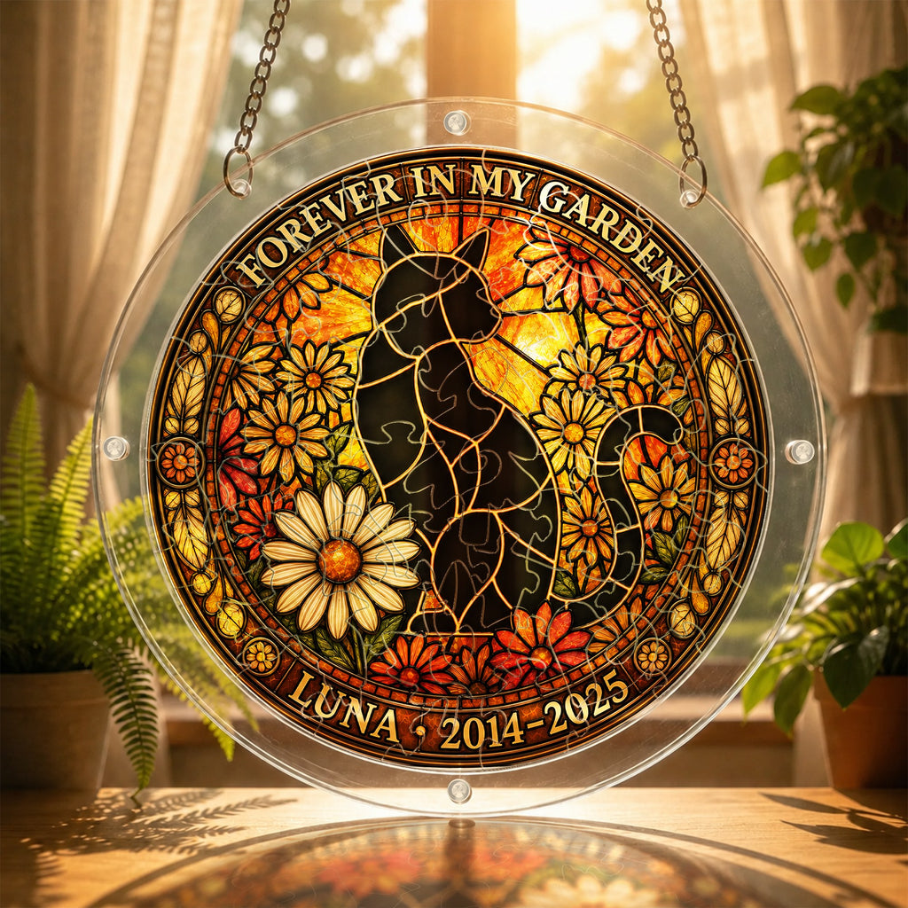 Cat memorial puzzle suncatcher glowing in a sunny window