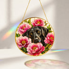 Black Lab & Peonies Glass Suncatcher glowing with sunlight