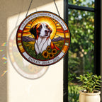 Dog memorial suncatcher casting colorful light by a sunny window