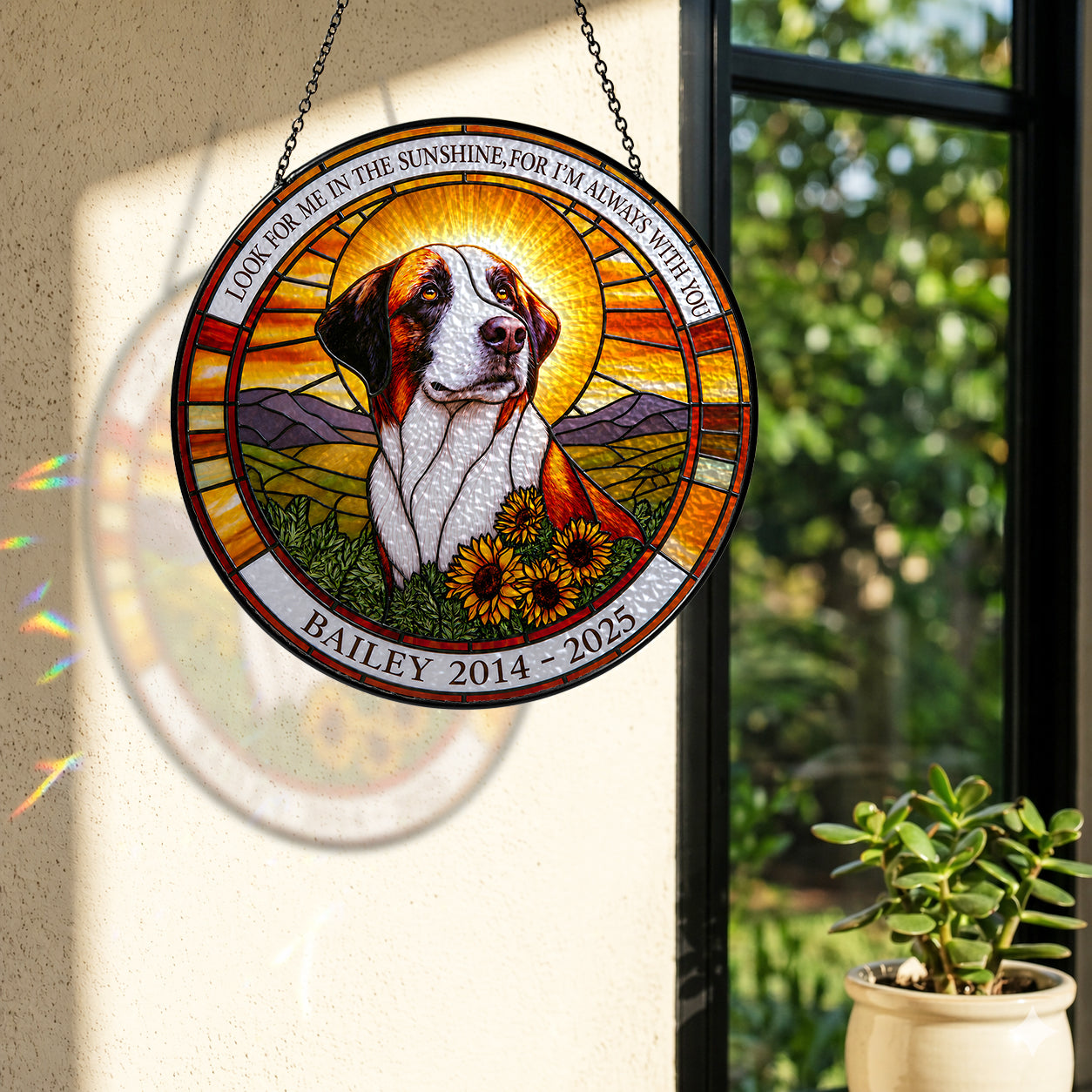 Dog memorial suncatcher casting colorful light by a sunny window