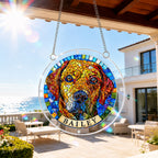 Rainbow mosaic dog memorial puzzle suncatcher hanging on a sunny patio with sky background
