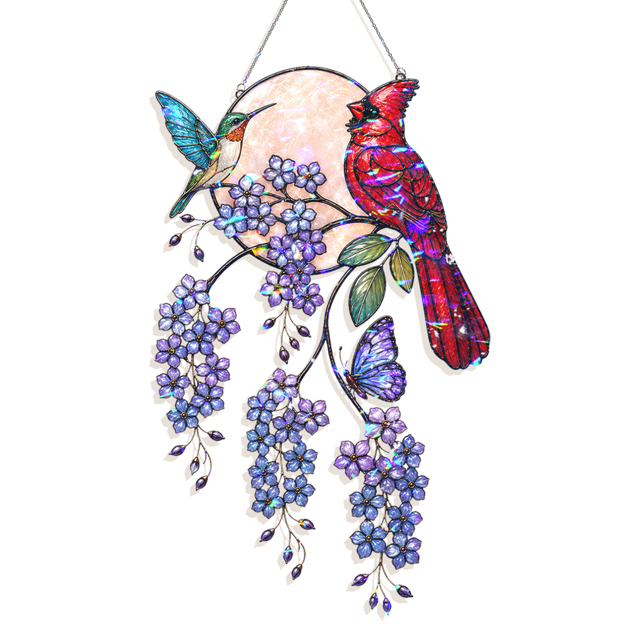 Stained glass hanging ornament featuring a red cardinal, a hummingbird, purple wisteria flowers, green leaves, and a purple butterfly against a pearlescent circular background, suspended by a silver string.
