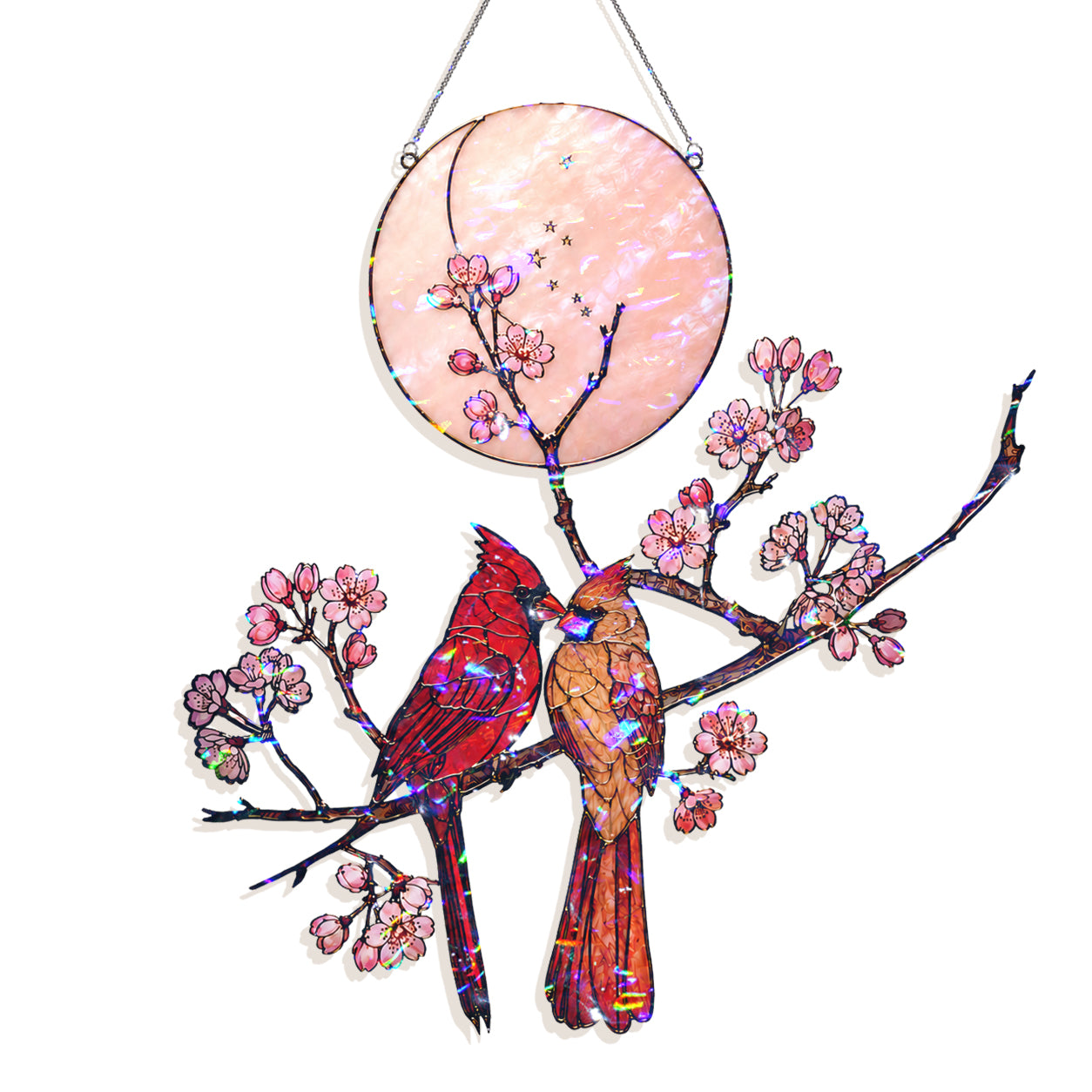 Stained glass hanging wall art featuring two cardinal birds on flowering branches in front of a round pink moon, shown on a white background.