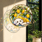 White Puppy & Lemons Glass Suncatcher hanging in a window