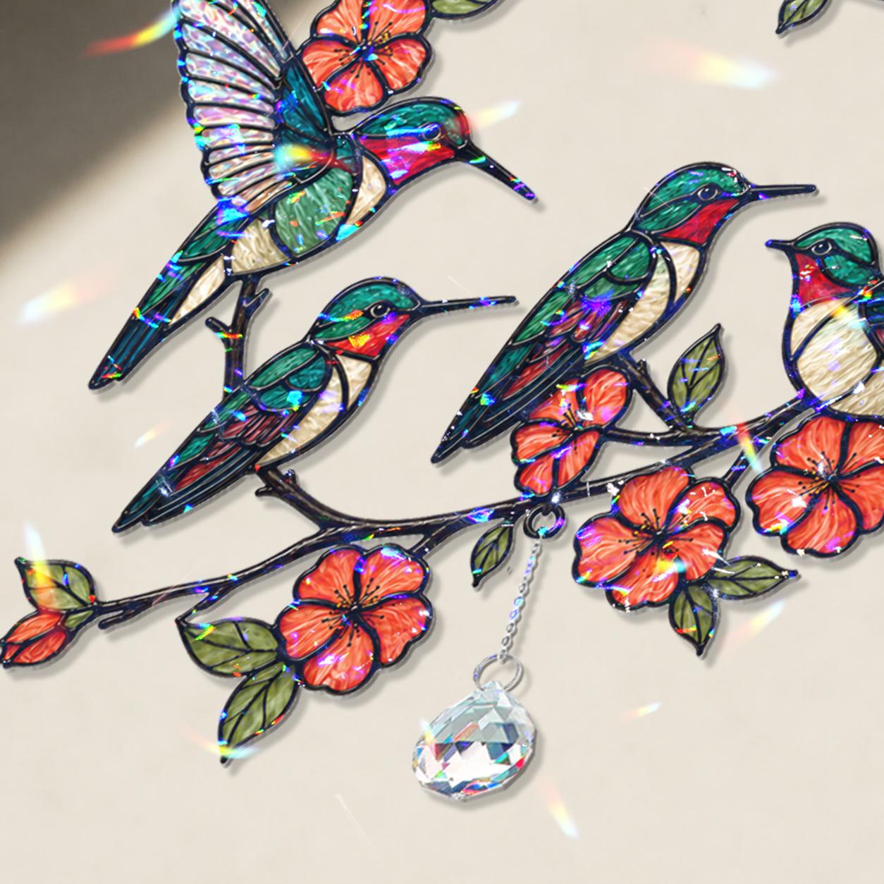 Decorative hologram arcylic suncatcher with colorful hummingbirds and flowers on a light background