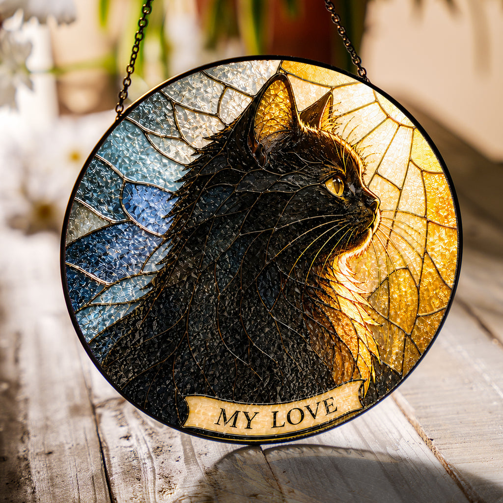 Black Cat Memorial Suncatcher hanging in a window