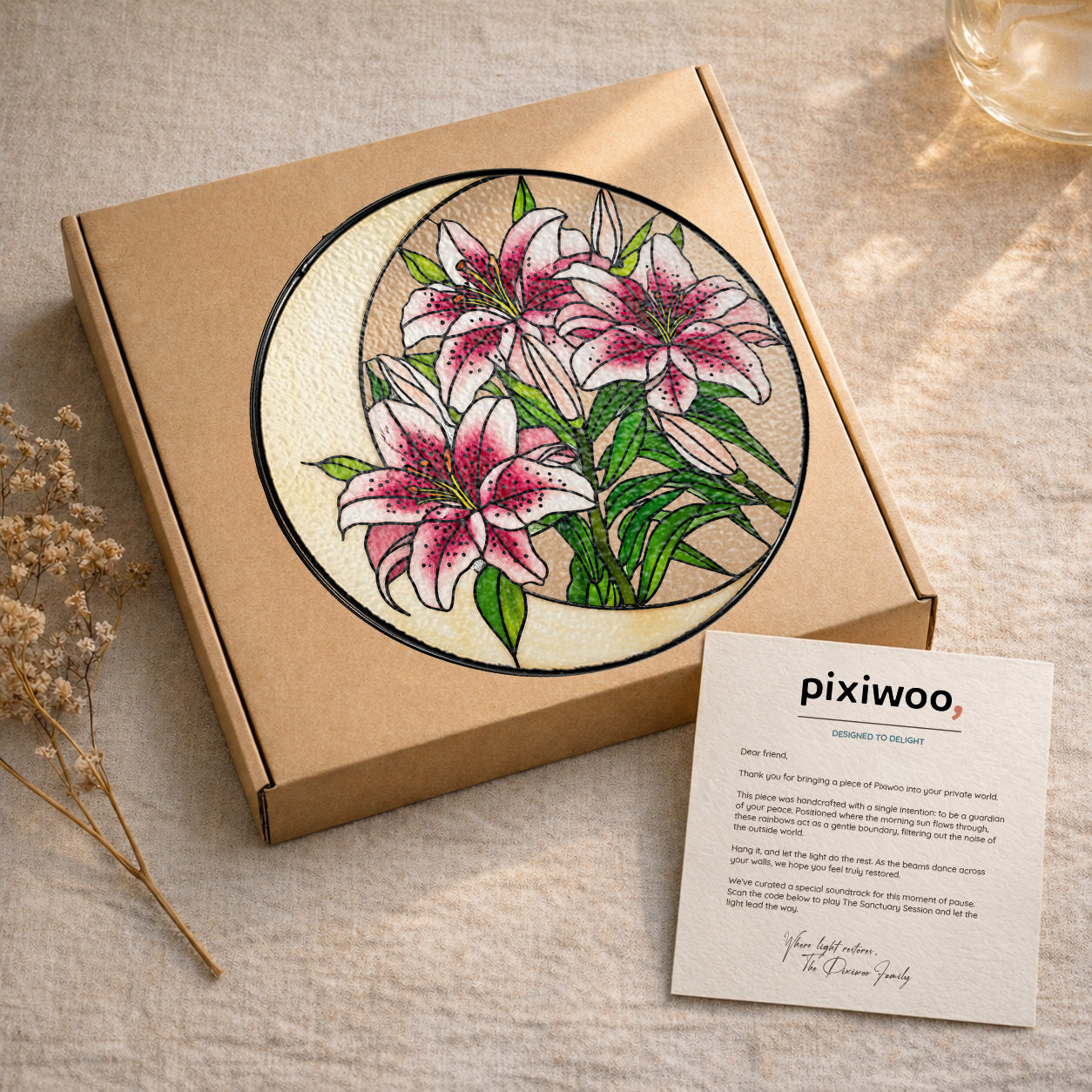 Pink lily stained glass suncatcher on Pixiwoo gift packaging with a thank-you card