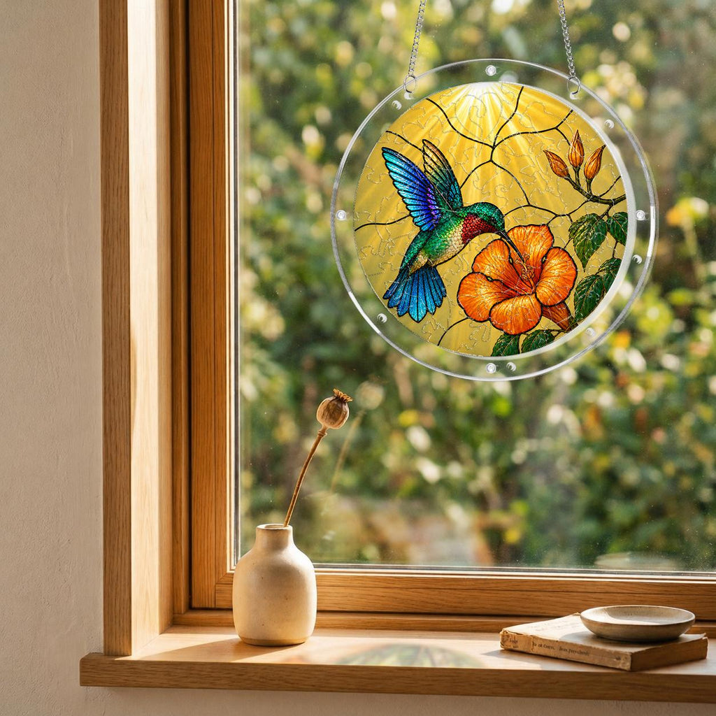 Hummingbird hibiscus puzzle suncatcher mounted on a clear round acrylic frame