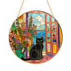 Black cat window stained glass suncatcher glowing with sunlight through the glass