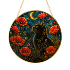 Black cat and red poppies stained glass suncatcher glowing with sunlight through the glass