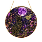 Celestial cat and purple moon stained glass suncatcher glowing with sunlight through the glass