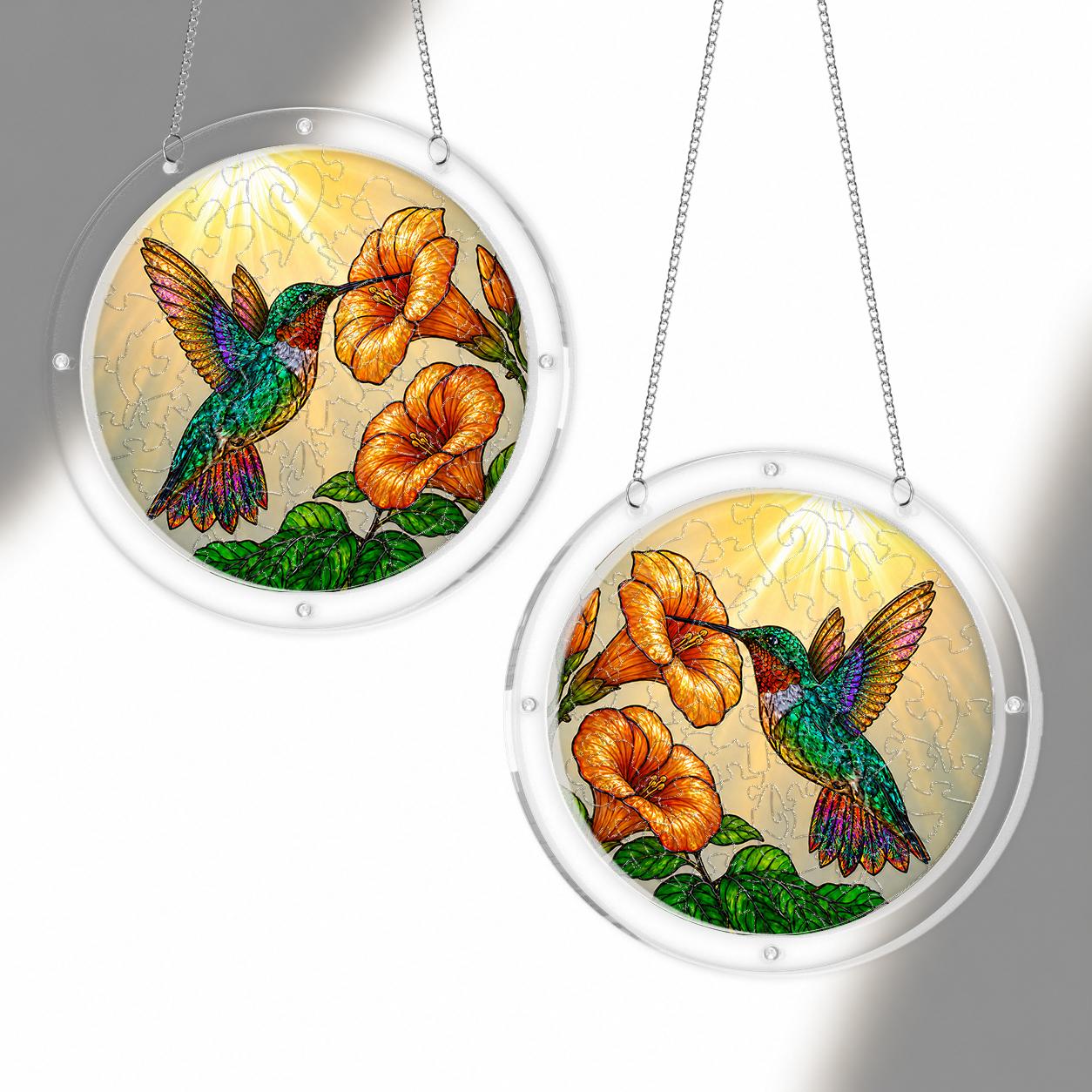 Hummingbird trumpet-flower puzzle suncatcher mounted on a clear round acrylic frame
