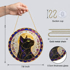 Mystical cat moon mandala stained glass suncatcher hanging in a sunlit window
