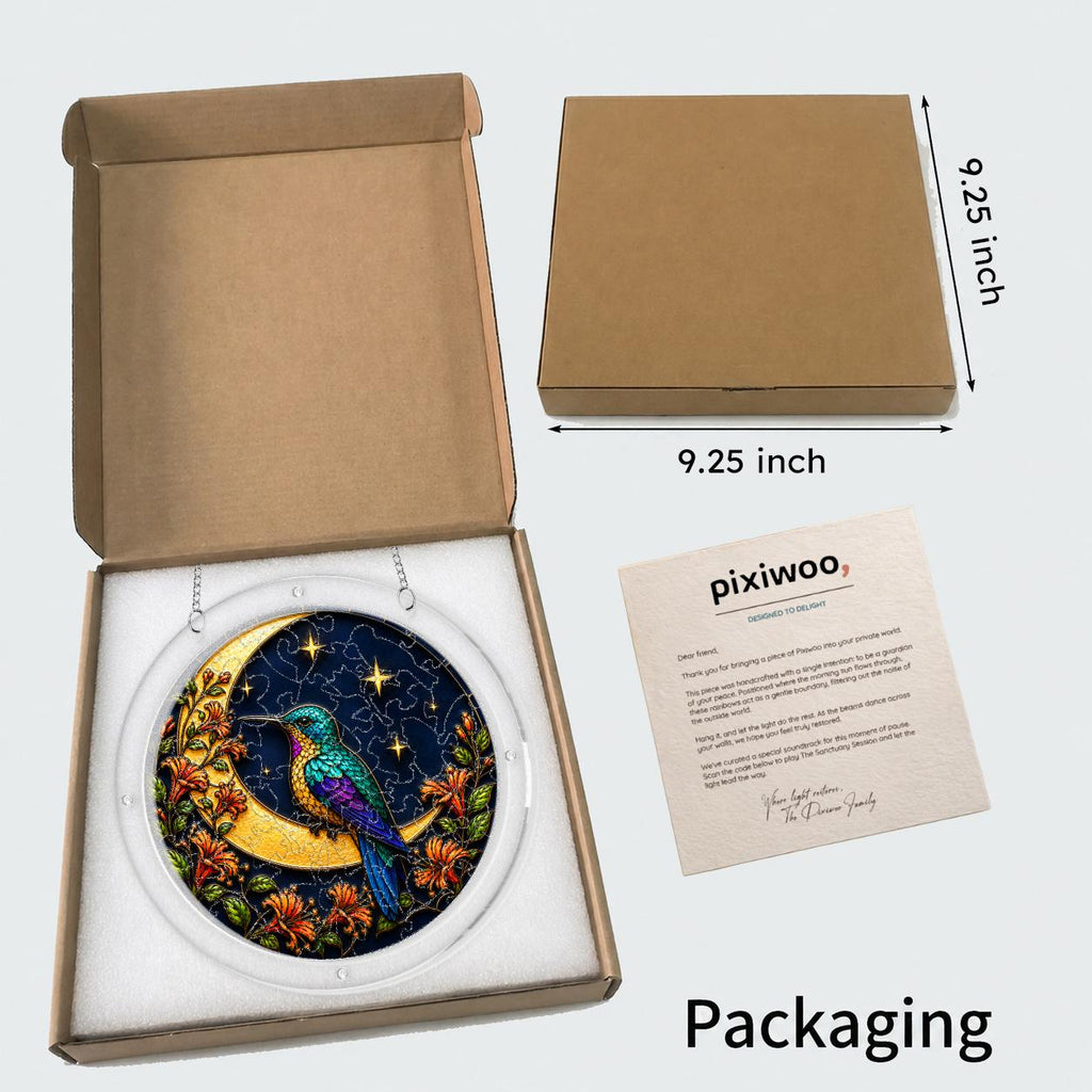 Hummingbird crescent-moon puzzle suncatcher shown in its kraft gift box