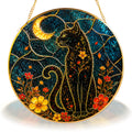 Black cat crescent moon stained glass suncatcher displayed as window decor