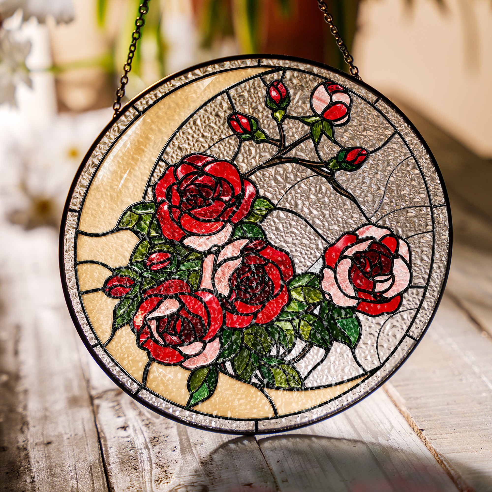 Red rose stained glass suncatcher in a bright window with soft daylight