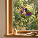 Round hummingbird and pink fuchsia puzzle suncatcher hanging in a cozy indoor window with soft sunlight