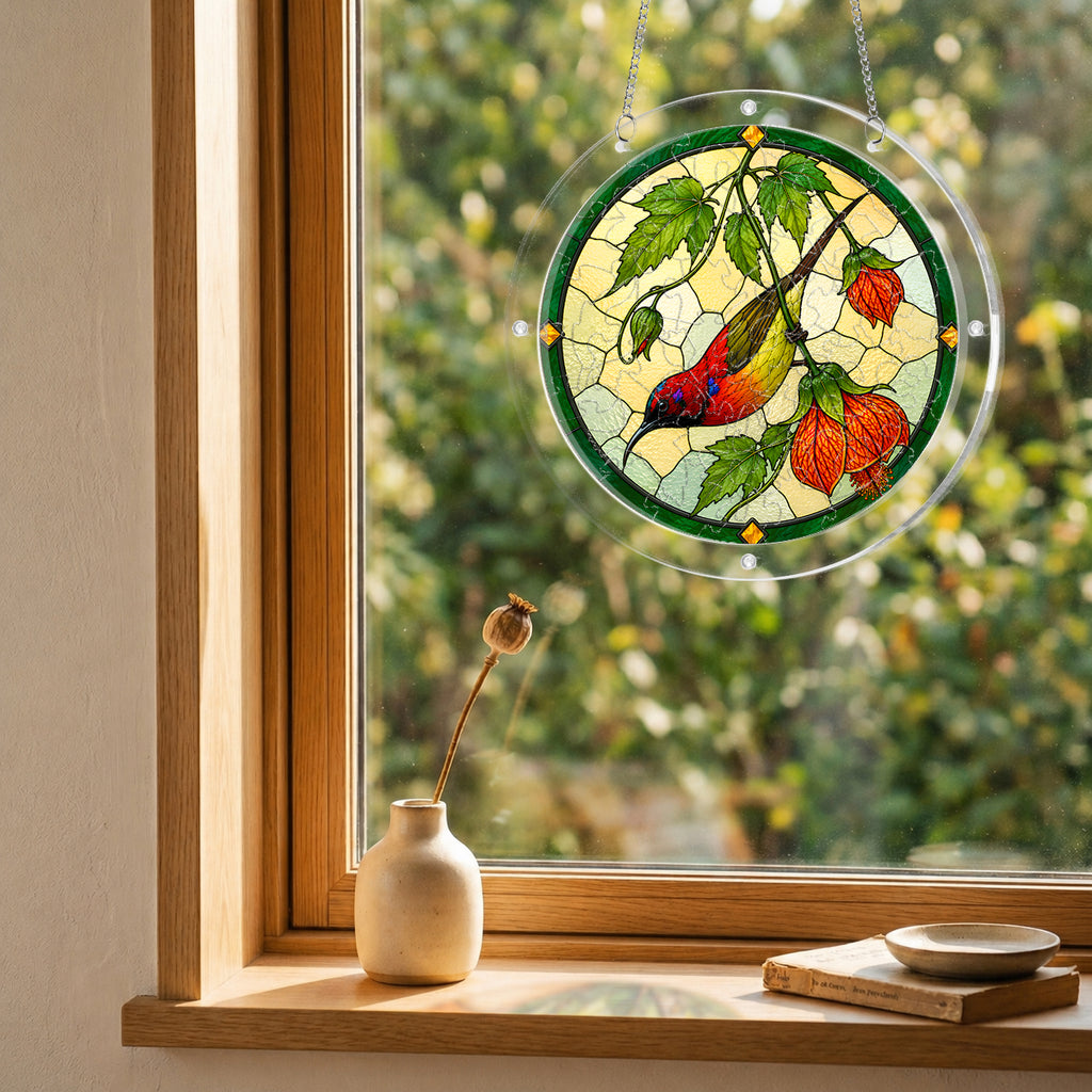Round red songbird autumn puzzle suncatcher hanging in a cozy indoor window with soft natural light