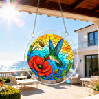 Hummingbird poppy acrylic puzzle suncatcher hanging on an outdoor patio window with a sunny balcony view