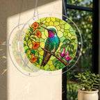 Round stained-glass-style hummingbird floral puzzle suncatcher hanging in warm natural window light