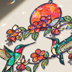 Close up of hummingbird and fuchsia flower artwork with broken glass hologram reflections