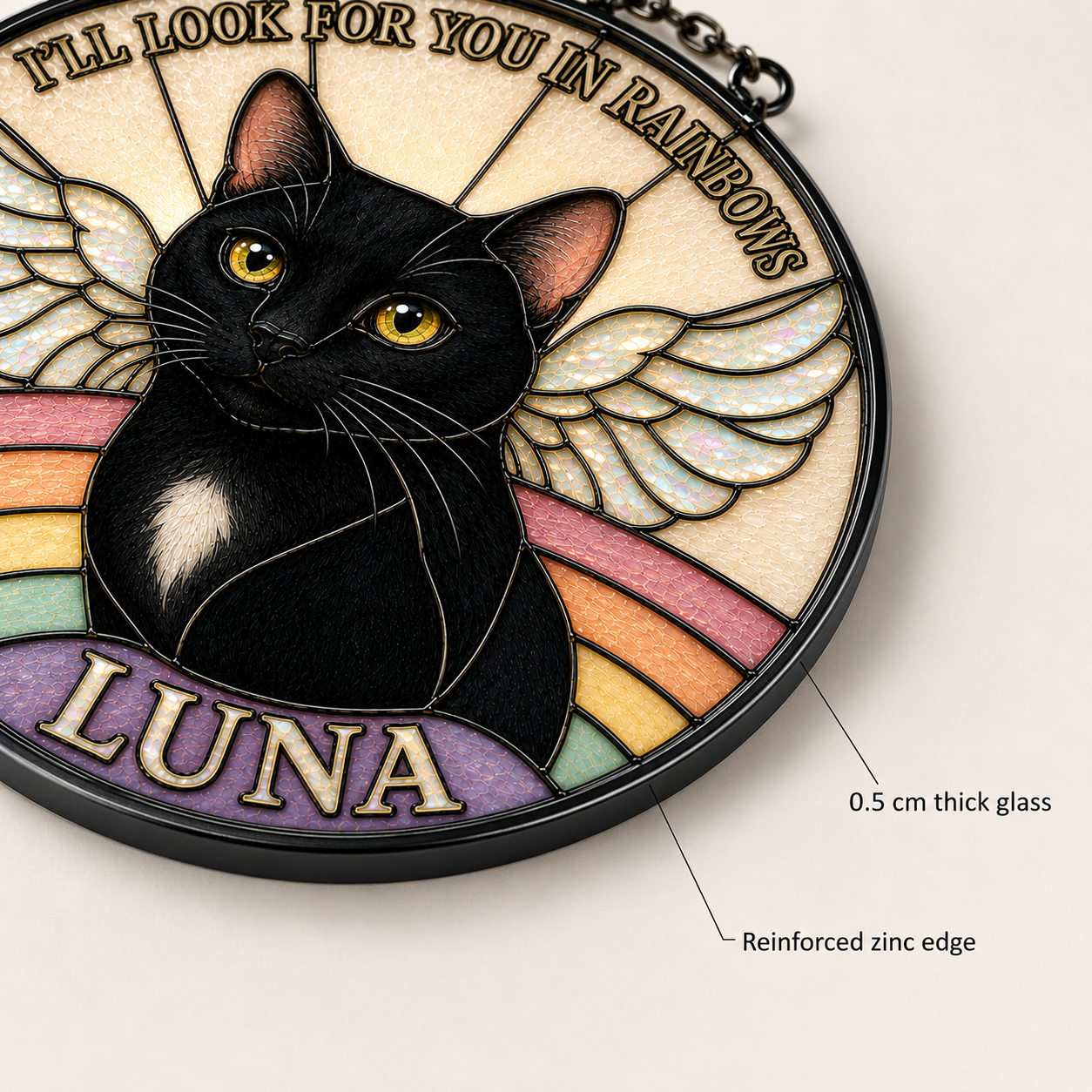 Close-up detail of a personalized black cat memorial glass suncatcher showing custom pet portrait, stained-glass style texture, angel wings, and reinforced zinc edge.
