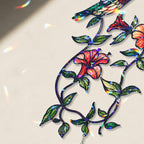 Close up detail of the hummingbird blooming vine holographic acrylic suncatcher showing floral artwork and hologram finish