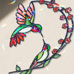 Close up detail of hummingbird cherry blossom moon holographic acrylic suncatcher with red blossoms and rainbow hologram finish