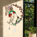 Hummingbird cherry blossom moon holographic acrylic suncatcher hanging by a sunny window with rainbow reflections