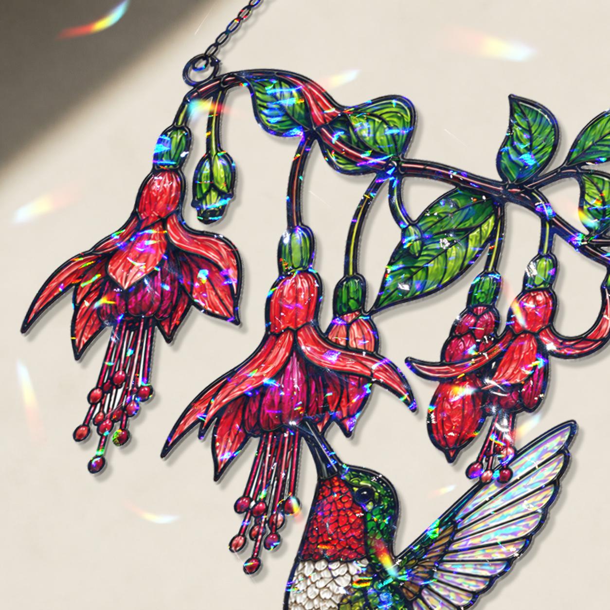 Close-up of the hummingbird and fuchsia flower design with a stained-glass-inspired broken glass