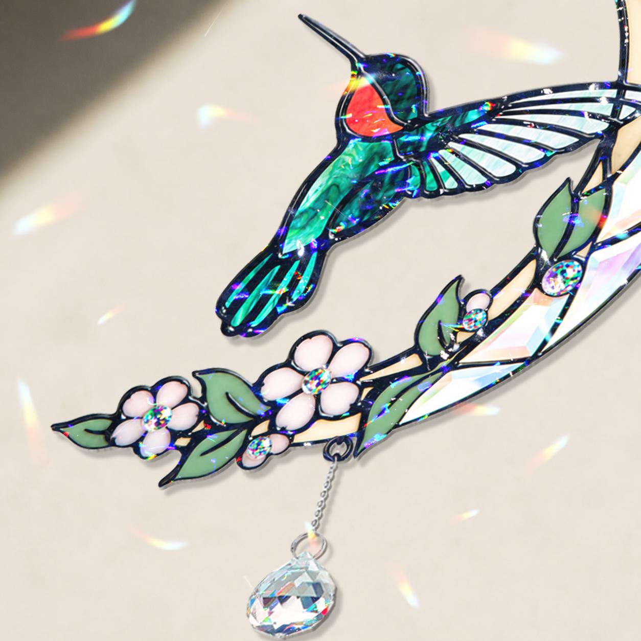 Close up detail of the hummingbird moon blossom holographic acrylic suncatcher showing blossoms crystal charm and hologram finish