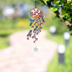 Hummingbird holographic acrylic suncatcher hanging outdoors with blooming branch design and crystal charm