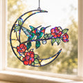 Hummingbird crescent moon holographic acrylic suncatcher hanging on a sunny window