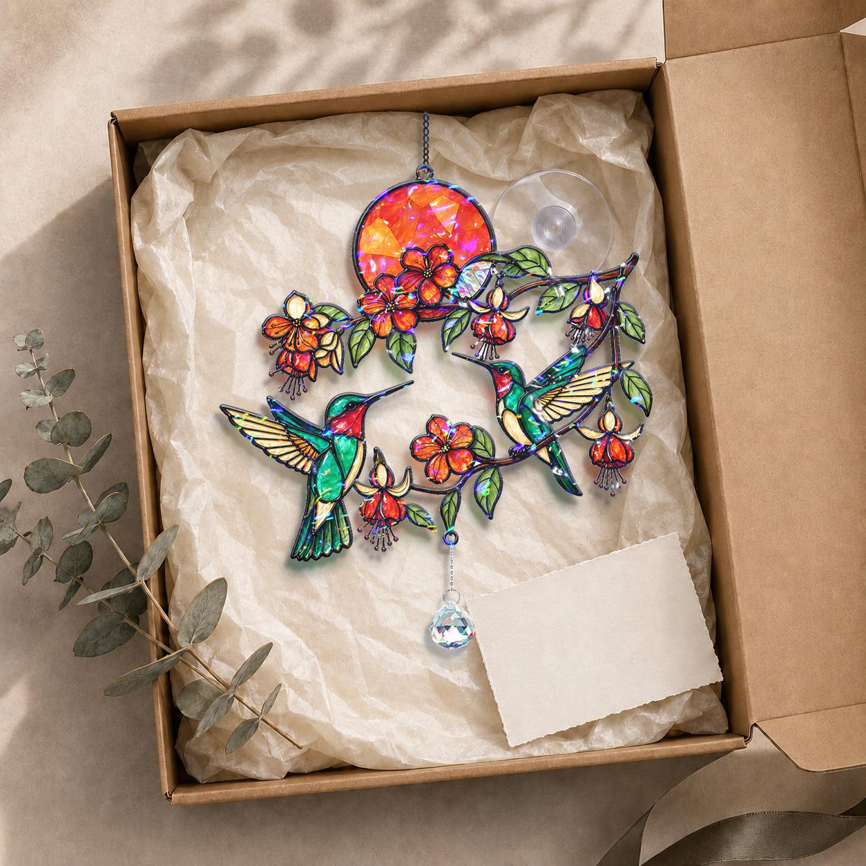 Hummingbird fuchsia sunset acrylic suncatcher placed in a gift box with hanging accessories