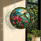 Round stained-glass-style hummingbird and crimson flower puzzle suncatcher displayed in natural window light