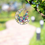 Moonlit hummingbird garden holographic acrylic suncatcher hanging by a sunny window with soft rainbow reflections
