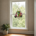 Personalized frog couple scooter suncatcher seen from a living room window